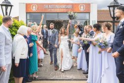 the nottinghamshire wedding photography bride groom walking confetti